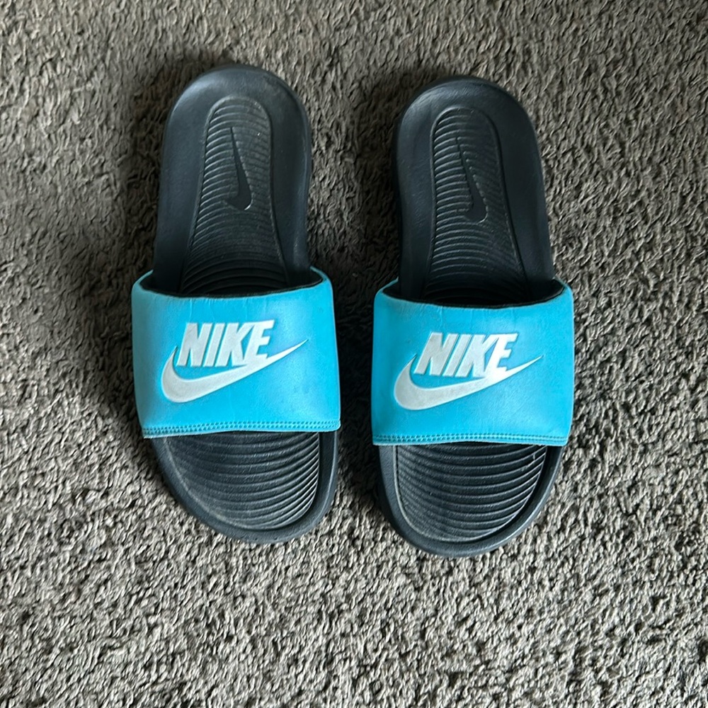 Light blue/white Nike slides